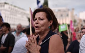 Pro-eurozone protesters gather in front of the parliament building in Athens on 30 June.