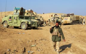 Iraqi pro-government tribal forces hold a position of Ramadi on December 16,