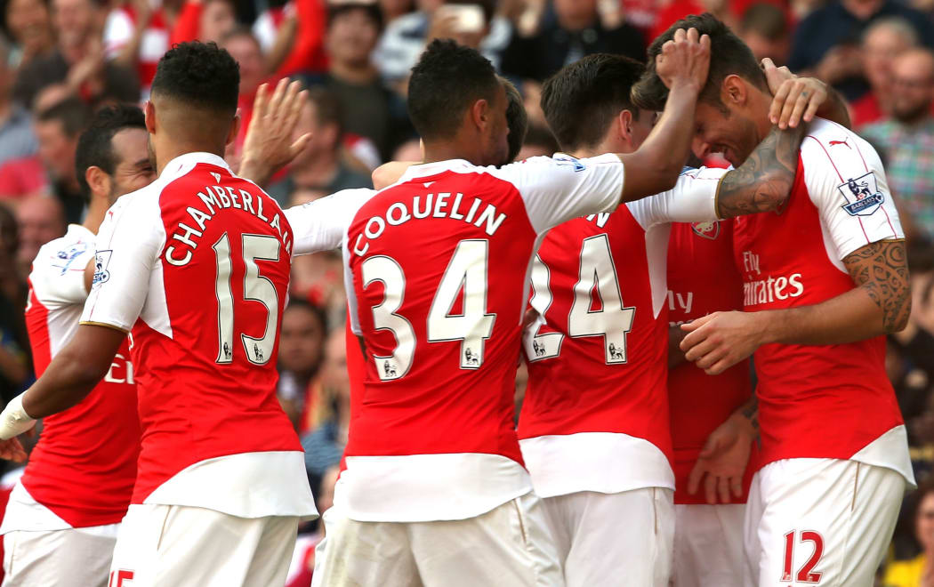 Arsenal players celebrate Olivier Giroud's goal.