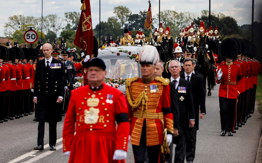 The Procession following the coffin of Queen Elizabeth II, aboard the State Hearse, arrives at The Long Walk in Windsor on September 19, 2022, to make its final journey to Windsor Castle after the State Funeral Service of Britain's Queen Elizabeth II.
