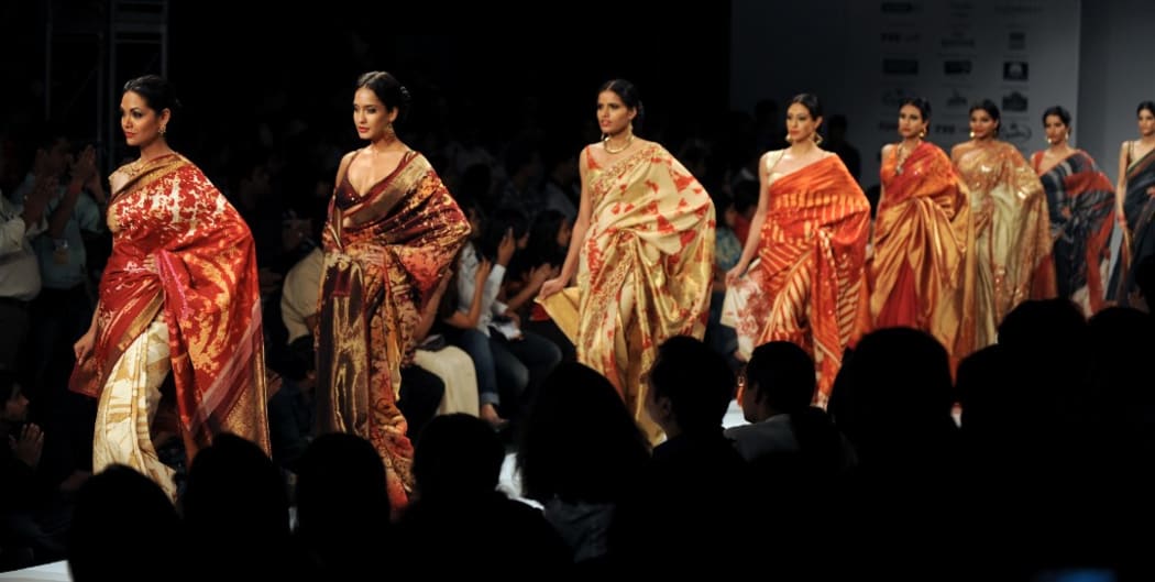 (FILES) In this file photo taken on September 12, 2009 models display creations by designer Satya Paul during the Kolkata Fashion Week II in Kolkata. -