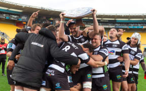 Tom Parsons of Hawkes Bay takes Ranfurly Shield to team after winning it from the Wellington Lions at Sky Stadium on 30 September 2023.