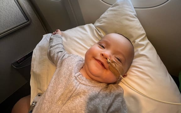 Baby Mana on her flight back home to the Cook Islands.