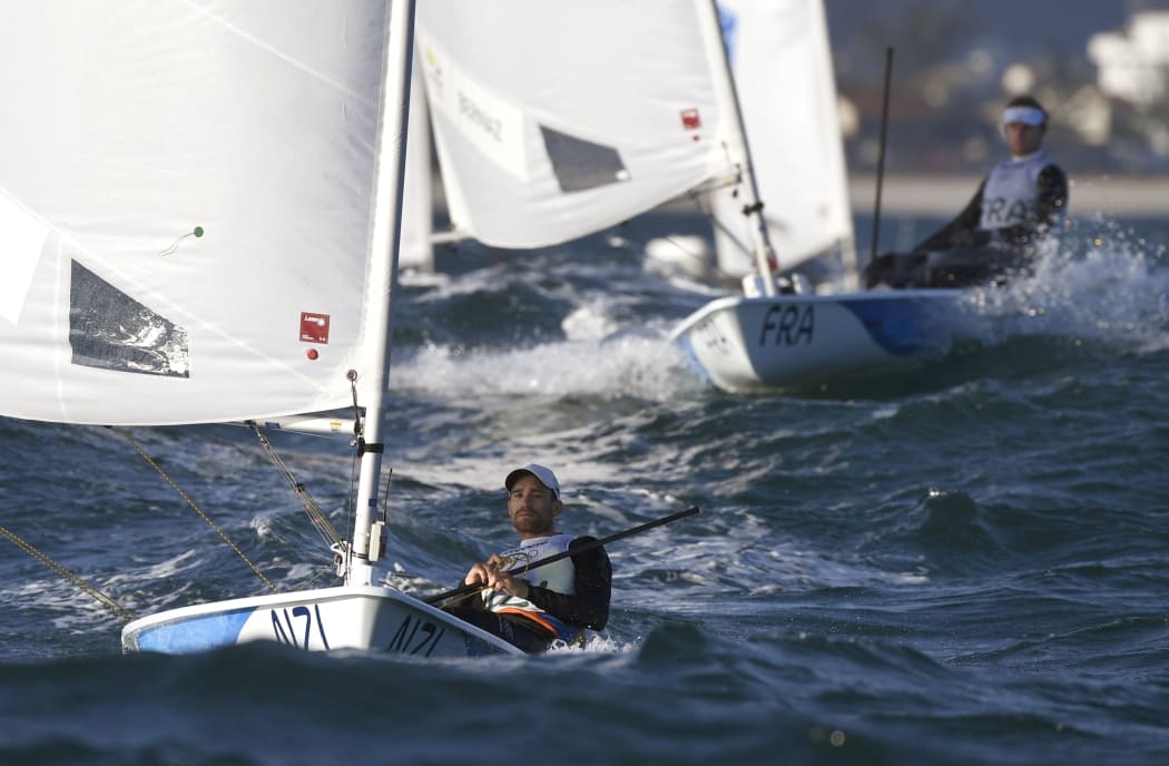 New Zealand's Sam Meech competes in the Laser Men sailing class on Guanabara Bay in Rio de Janerio during the Rio 2016 Olympic Games on August 13, 2016.