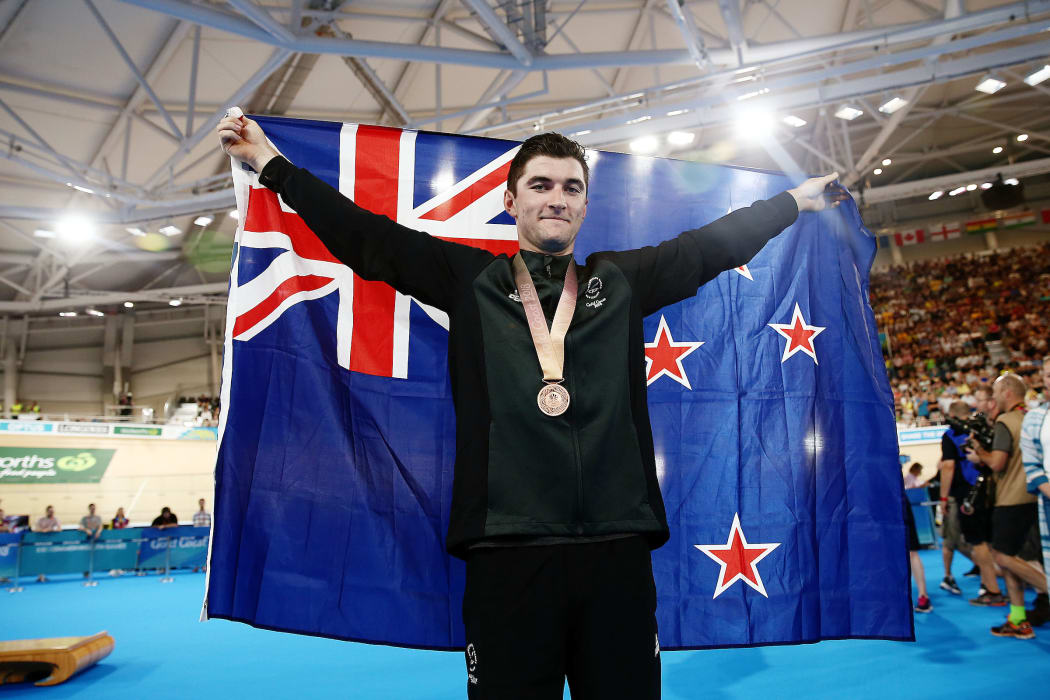 Dylan Kennett wins bronze in the Men's 4000m Individual Pursuit.