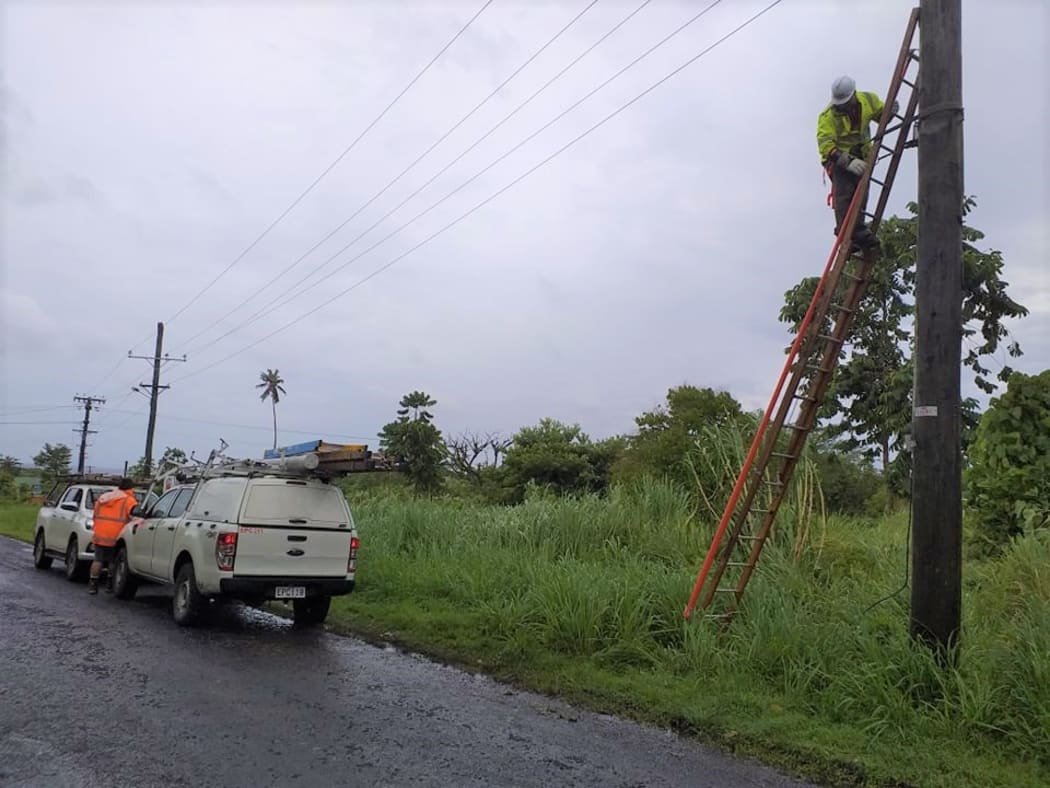 Linesmen repair damage caused by Cyclone Tino