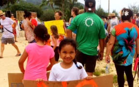 A young protester in the Cook Islands. The government has a draft agreement with the European Union for Spanish purse seine vessels to fish in its waters.