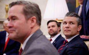 US National Security Adviser Michael Waltz (L), US Vice President J.D. Vance (rear), and Defense Secretary Pete Hegseth (R, listen to a question from a reporter during a meeting in the Oval Office of the White House, Washington, DC, on March 13, 2025. A US journalist was inadvertently included in a group chat in which Defense Secretary Pete Hegseth, Vice President JD Vance and other top officials discussed upcoming strikes against Yemen's Huthi rebels, the White House confirmed on March 24, 2025. (Photo by Andrew Harnik / GETTY IMAGES NORTH AMERICA / AFP)
