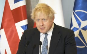 British PM Boris Johnson is seen at a press conference at the Chancellery of the Prime Minister in Warsaw, Poland on 10 February, 2022.