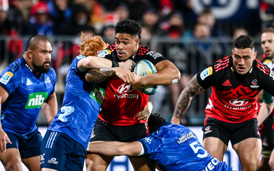 Leicester Faingaanuku of the Crusaders is tackled by Finlay Christie of the Blues during the Super Rugby Pacific Rugby Semi Final match, Crusaders Vs Blues, at Orangetheory Stadium, Christchurch, New Zealand, 16th June 2023.