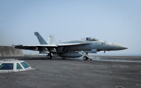 An F/A-18E Super Hornet launches from aircraft carrier USS Theodore Roosevelt on 21 August 2015 in the Gulf, as part of the US-led coalition's operations in Iraq and Syria.