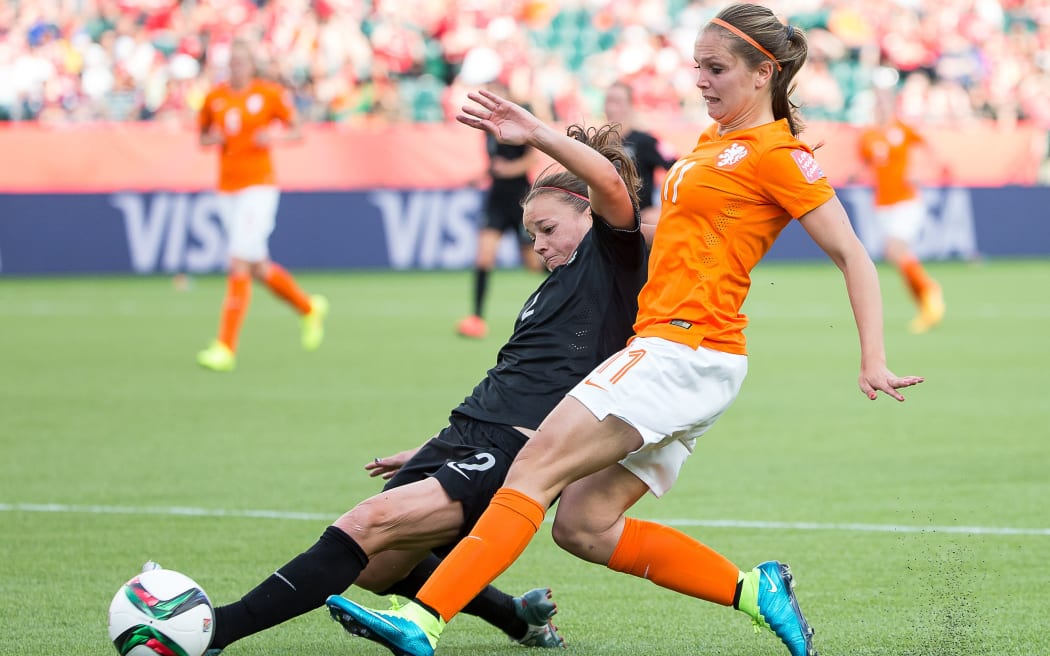 Ria Percival slides into Lieke Martens