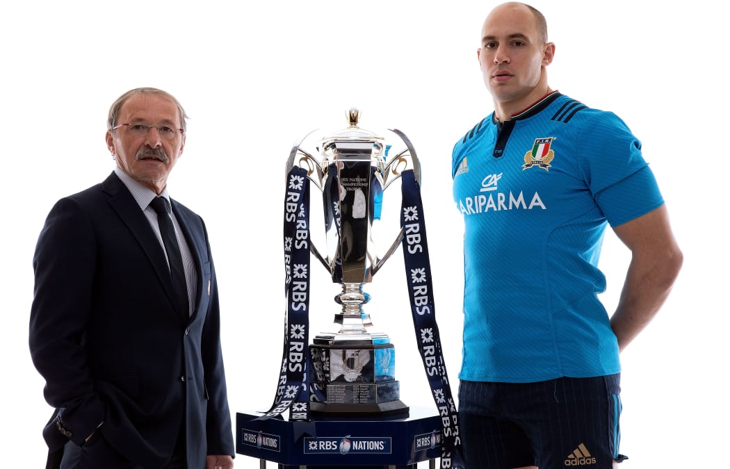 Italy coach Jacques Brunel and captain Sergio Parisse pose with the Six Nations trophy.
