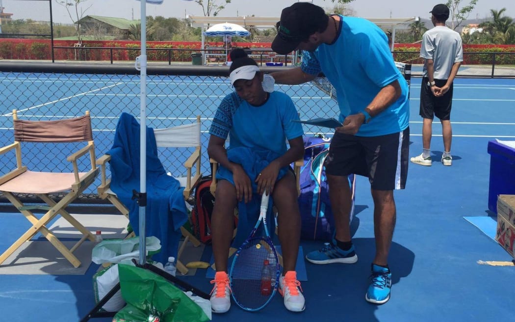 Papua New Guinea's Abigail Tere-Apisah receives instructions during her singles match.