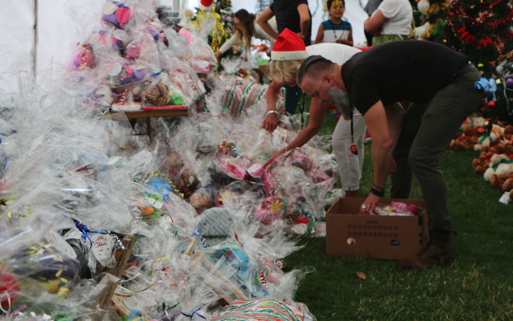 Mounds of presents waiting to be unwrapped and taken home from the Christchurch City Mission lunch