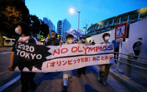 TOKYO, JAPAN - MAY 09: People stage a demonstration as they demand Tokyo Olympics to cancelled due to coronavirus pandemic in Tokyo, Japan on May 9, 2021.