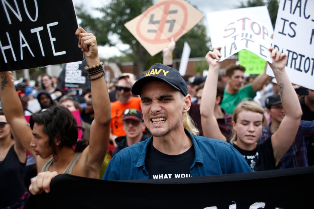 Demonstrators gather at the site of a planned speech by white nationalist Richard Spencer, who popularized the term 'alt-right', at the University of Florida campus on October 19, 2017 in Gainesville, Florida.
