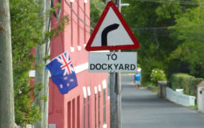Large New Zealand flags have appeared on the road leading to the Cup Village in Bermuda.