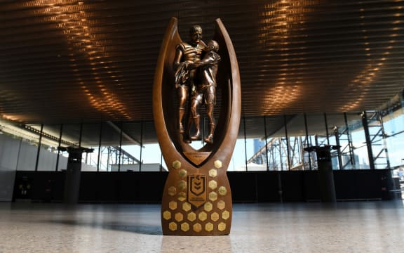 The NRL trophy featuring Norm Provan (left) and Arthur Summons.