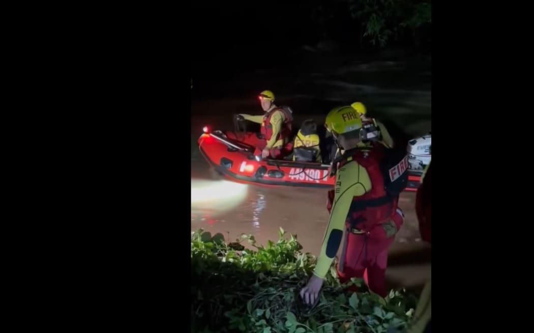Five people were rescued after fast, rising floodwaters left them trapped near Mudgeeraba.