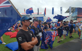 Team New Zealand fans cluster in front of the dockout show stage,