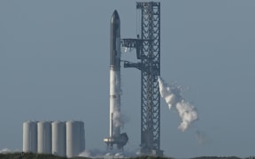 The SpaceX Starship rocket stands on the launchpad from the SpaceX Starbase in Boca Chica as seen from South Padre Island, Texas on 17 April, 2023.