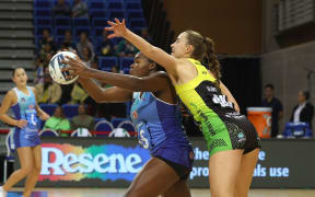 Mystic's Grace Nweke (L) with Pulse's captain Kelly Jury