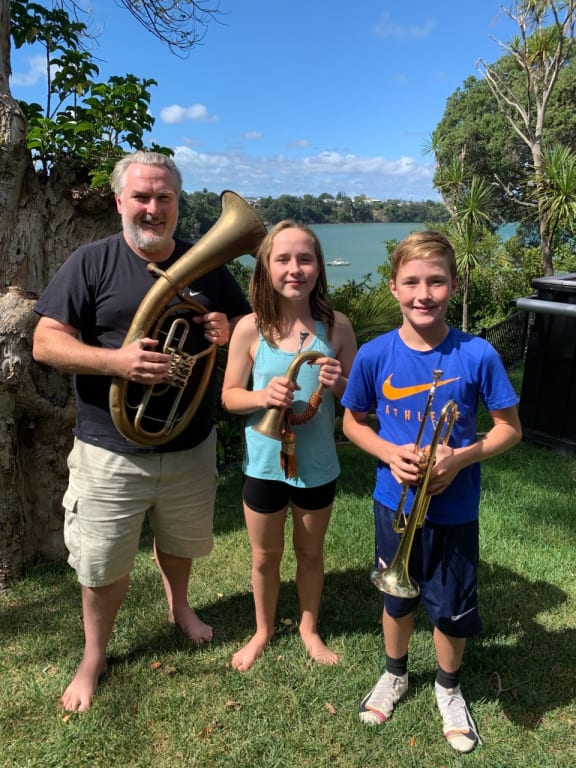 Simon O'Neill with his Bayreuth Kaiserhorn gives his children a brass instrument lesson.