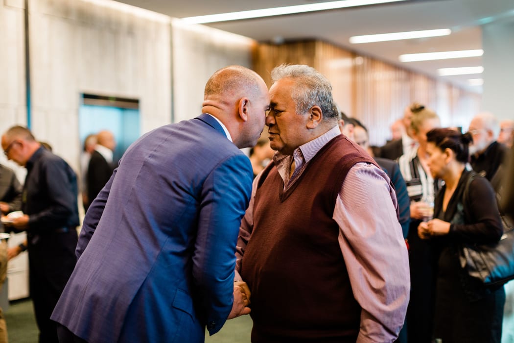 Kleat Nepe, of Sealord, and Puhirake Ihaka, of Ngai Te Rangi, share a hongi at the signing of Nga Tapuwae o Maui.