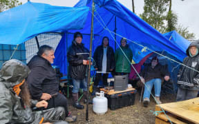 About 20 protesters have set up camp at the summit of Mt Messenger.