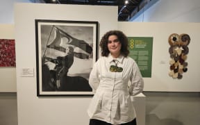 The winner of the 2025 Kiingi Tuheitia Portraiture Award Jazmin Tainui Mihi Paget-Knebel with her winning photo Taniwha Chasers.