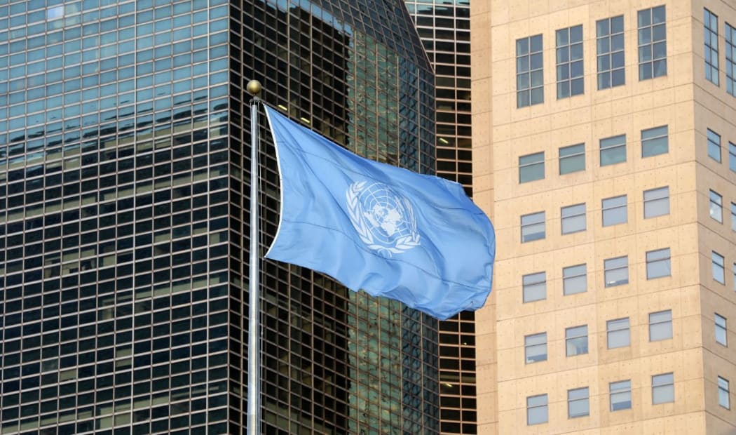 The UN flag flies outside the United Nations General Assembly Hall in New York City.