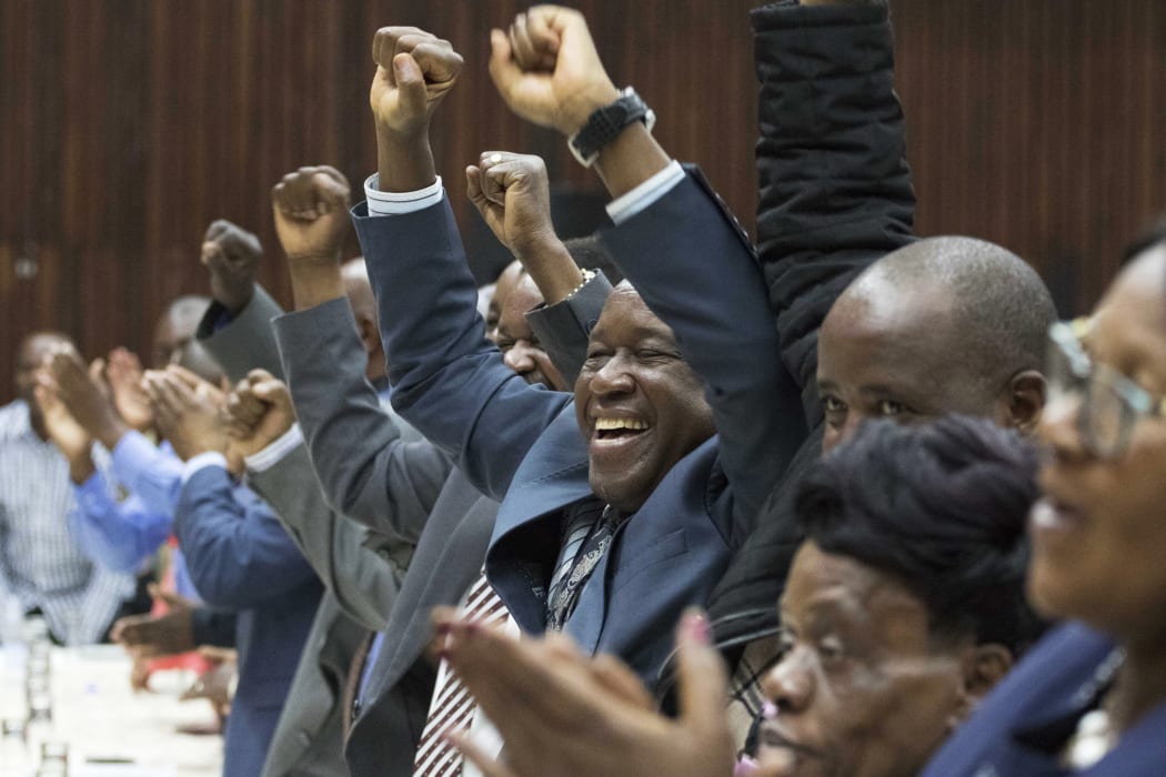The announcement Mr Mugabe was being removed as leader drew cheers from the 200 delegates packed into Zanu-PF's Harare headquarters.