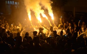 Supporters of the pro-Kurdish Peoples' Democratic Party celebrate the results of the Turkish presidential and parliamentary elections.