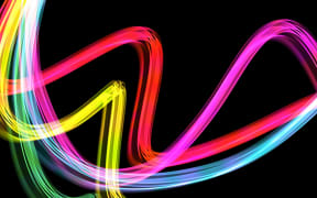 Curving waves of light in the colours of the rainbow
