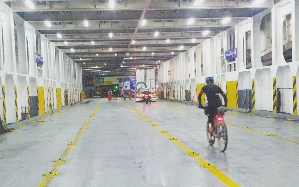 Michael Dann disembarking the Cook Strait ferry during Tour Aotearoa, a bike tour that travels the full length of New Zealand.