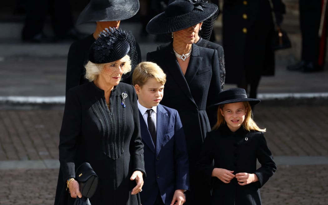 Left to right Britain's Camilla, Queen Consort, Britain's Prince George of Wales, Britain's Catherine, Princess of Wales and Britain's Princess Charlotte of Wales walk outside Westminster Abbey after a service on the day of the state funeral and burial of Britain's Queen Elizabeth, in London, Britain, on September 19, 2022.