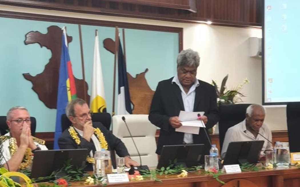 Wali Wahetra sitting with congress member with overseas territories minister.