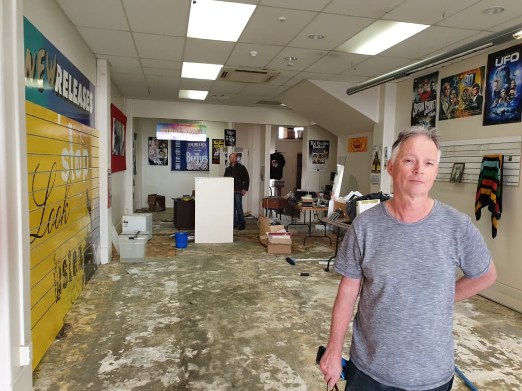 Dean Mardon was able to save CDs, DVDs and records from his sodden record shop, Electric City Music, on Dalton St.