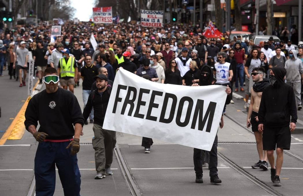 Protesters march through the streets during an anti-lockdown rally in Melbourne on 21 August.