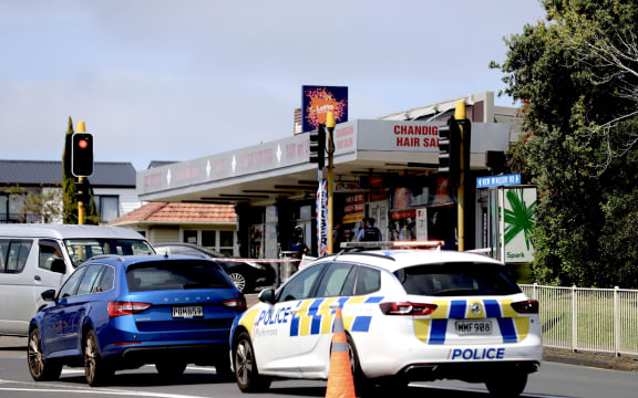 A police car outside the New Windsor dairy in Auckland.
