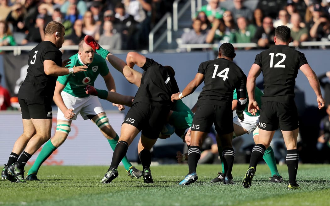 Joe Moody tackles Ireland's Rob Kearney at Soldier Field in Chicago.