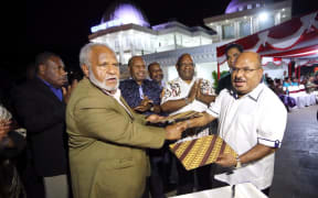 Papua New Guinea's Madang Governor Peter Yama left with the Governor of Indonesia's Papua province, Lukas Enembe in Jayapura. October 2018
