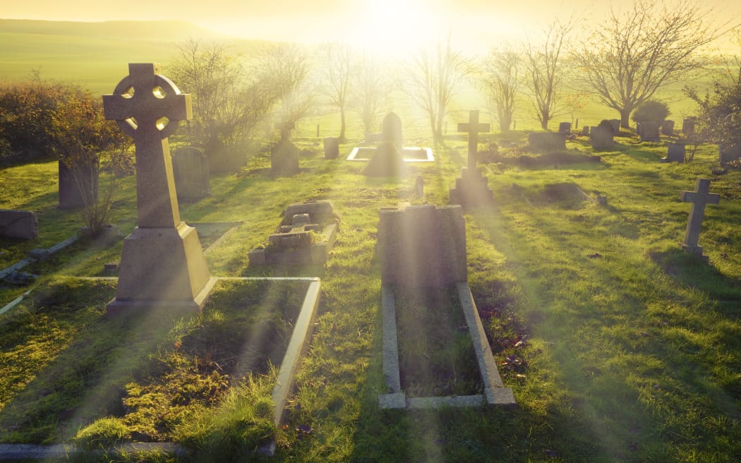 Heavenly light shining upon a old graveyard in England, United Kingdom.