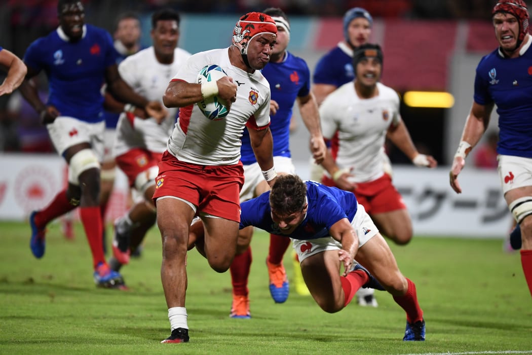 Tongas captain Siale Piutau finds some open space.