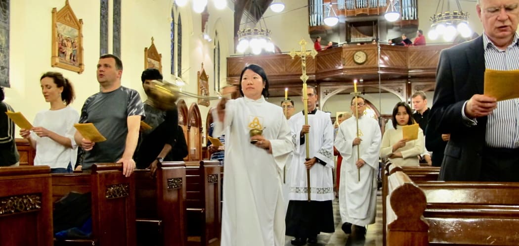 Opening procession led by Myrna Contreras, sacristan