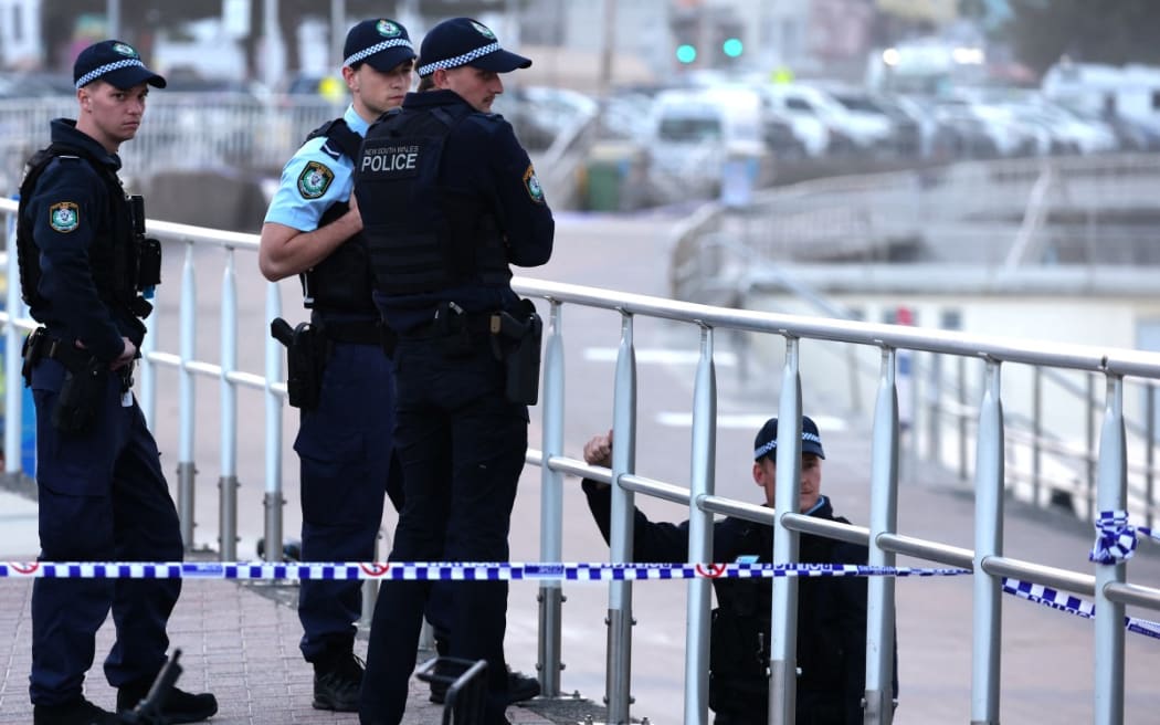 Police patrol Bondi Beach in Sydney on 15 December 2025  as they investigate the scene where two gunmen shot and killed 15 people at a Jewish celebration.