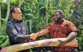 The Vanuatu opposition leader, Ralph Regenvanu, (Left) welcomes the newly resigned former government MP Robin Kapapa to the fold. 3 September 2020