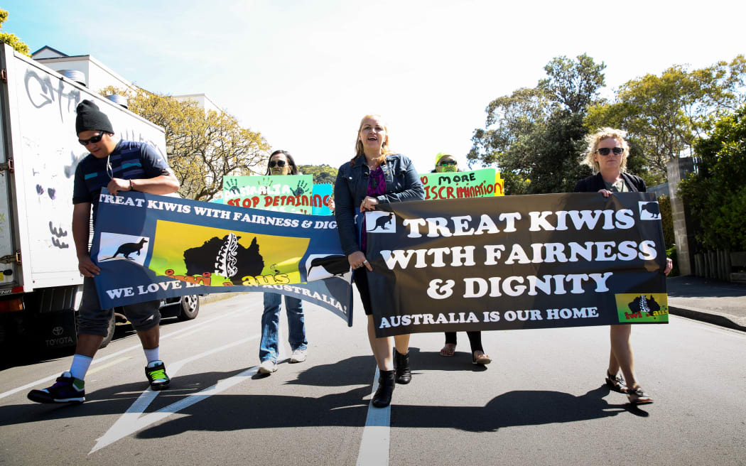 Erina Morunga and protesters march from the Australian High Commission