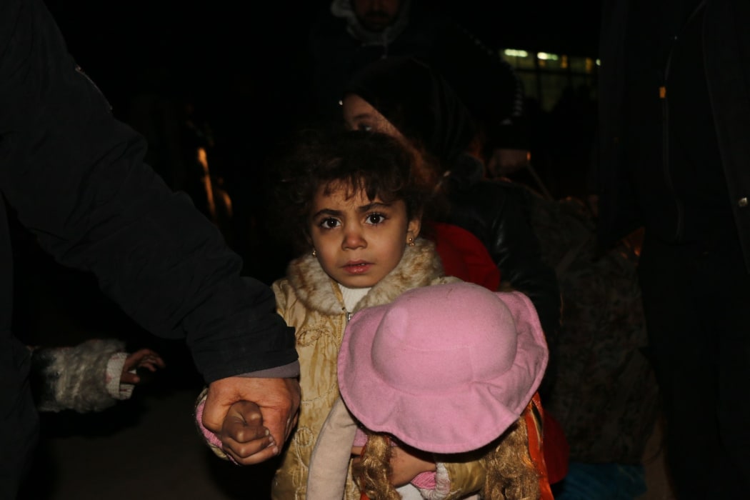 Civilians, trying to flee from East Aleppo that had been under siege by Iran led Shiite militias and Assad Regime forces, reach the transfer center at Etarib district of Aleppo Syria on December 15, 2016